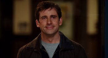 Movie still from “Dan in Real Life” (2007), directed by Peter Hedges – A person smiling for the camera; Close Up shot, Over the shoulder angle