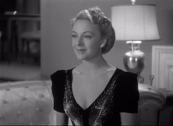 Movie still from “Dance, Girl, Dance” (1940), directed by Roy Del Ruth – A black and white photo of a woman smiling; Close Up shot, Low angle