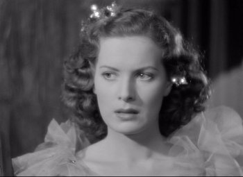 Movie still from “Dance, Girl, Dance” (1940), directed by Roy Del Ruth – A black and white photo of a woman with hair clips in her hair; Close Up shot, High angle