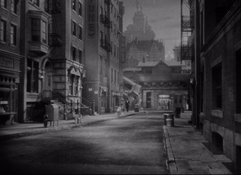 Movie still from “Dance, Girl, Dance” (1940), directed by Roy Del Ruth – An old photo of an empty city street; Extreme Wide shot, High angle