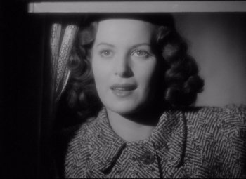 Movie still from “Dance, Girl, Dance” (1940), directed by Roy Del Ruth – An old photo of an older woman with curly hair; Close Up shot, Low angle