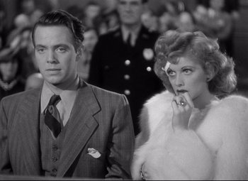 Movie still from “Dance, Girl, Dance” (1940), directed by Roy Del Ruth – A man and a woman standing next to each other; Medium shot, Low angle