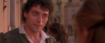 Movie still from “Dangerous Beauty” (1998), directed by Marshall Herskovitz – A person wearing a shirt; Close Up shot, Over the shoulder angle