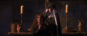 Movie still from “Dangerous Beauty” (1998), directed by Marshall Herskovitz – A woman and a man dressed as a nun; Medium shot, Low angle