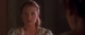 Movie still from “Dangerous Beauty” (1998), directed by Marshall Herskovitz – A person wearing a dress; Close Up shot, Over the shoulder angle