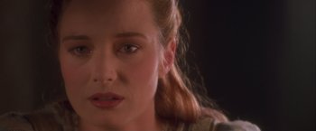 Movie still from “Dangerous Beauty” (1998), directed by Marshall Herskovitz – A woman's face in a dark room; Close Up shot, Over the shoulder angle