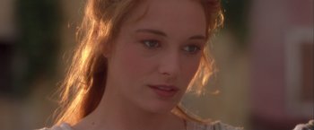 Movie still from “Dangerous Beauty” (1998), directed by Marshall Herskovitz – A woman's face in a white dress; Close Up shot, Over the shoulder angle