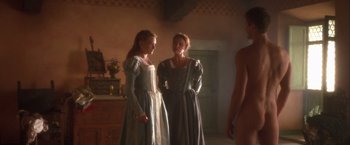 Movie still from “Dangerous Beauty” (1998), directed by Marshall Herskovitz – Two women dressed in period clothing standing next to each other in a room; Wide shot, Over the shoulder angle