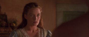 Movie still from “Dangerous Beauty” (1998), directed by Marshall Herskovitz – A young woman looking at the camera in front of a mirror; Close Up shot, Over the shoulder angle