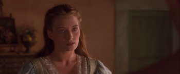 Movie still from “Dangerous Beauty” (1998), directed by Marshall Herskovitz – A beautiful woman with long hair wearing a white dress; Close Up shot, Over the shoulder angle