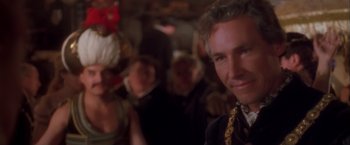 Movie still from “Dangerous Beauty” (1998), directed by Marshall Herskovitz – A person wearing a suit and tie; Close Up shot, Over the shoulder angle