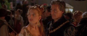 Movie still from “Dangerous Beauty” (1998), directed by Marshall Herskovitz – A man and a woman standing next to each other; Close Up shot, Over the shoulder angle