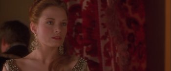 Movie still from “Dangerous Beauty” (1998), directed by Marshall Herskovitz – A beautiful woman in a red dress and a white dress; Close Up shot, Over the shoulder angle