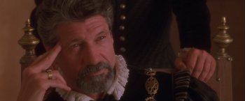 Movie still from “Dangerous Beauty” (1998), directed by Marshall Herskovitz – An older man with a beard wearing a black shirt; Close Up shot, Over the shoulder angle