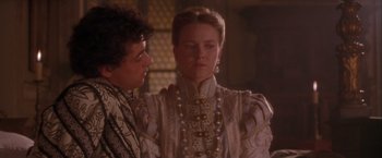 Movie still from “Dangerous Beauty” (1998), directed by Marshall Herskovitz – A man and a woman in a white dress; Medium shot, Over the shoulder angle