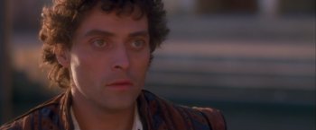 Movie still from “Dangerous Beauty” (1998), directed by Marshall Herskovitz – A man's face in a brown jacket; Close Up shot, Over the shoulder angle