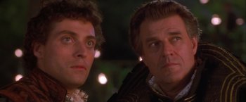 Movie still from “Dangerous Beauty” (1998), directed by Marshall Herskovitz – Two men in medieval garb looking at the camera; Close Up shot, Low angle