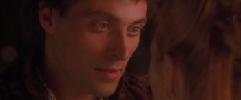 Movie still from “Dangerous Beauty” (1998), directed by Marshall Herskovitz – A man's face in a dark room; Close Up shot, Over the shoulder angle