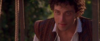 Movie still from “Dangerous Beauty” (1998), directed by Marshall Herskovitz – A person wearing a vest; Close Up shot, Over the shoulder angle