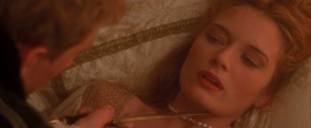Movie still from “Dangerous Beauty” (1998), directed by Marshall Herskovitz – A person holding a pair of chopsticks; Close Up shot, High angle