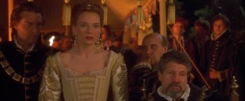 Movie still from “Dangerous Beauty” (1998), directed by Marshall Herskovitz – A group of people standing next to each other in a room; Close Up shot, Over the shoulder angle