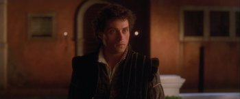 Movie still from “Dangerous Beauty” (1998), directed by Marshall Herskovitz – A person wearing a jacket; Close Up shot, Over the shoulder angle