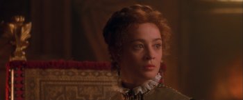 Movie still from “Dangerous Beauty” (1998), directed by Marshall Herskovitz – A person wearing a dress; Close Up shot, Over the shoulder angle