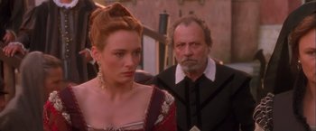 Movie still from “Dangerous Beauty” (1998), directed by Marshall Herskovitz – A man and a woman standing next to each other; Close Up shot, Over the shoulder angle