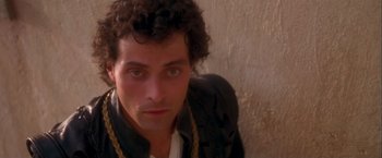 Movie still from “Dangerous Beauty” (1998), directed by Marshall Herskovitz – A person wearing a jacket; Close Up shot, Overhead angle