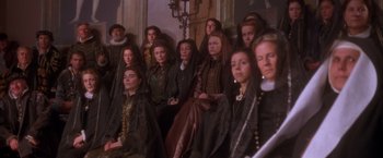 Movie still from “Dangerous Beauty” (1998), directed by Marshall Herskovitz – A group of people sitting in a room; Wide shot, High angle