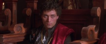 Movie still from “Dangerous Beauty” (1998), directed by Marshall Herskovitz – A person wearing a costume; Close Up shot, High angle