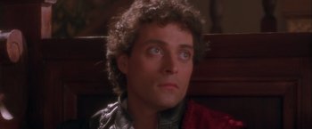 Movie still from “Dangerous Beauty” (1998), directed by Marshall Herskovitz – A person with curly hair; Close Up shot, Low angle