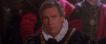 Movie still from “Dangerous Beauty” (1998), directed by Marshall Herskovitz – A person wearing a suit and tie; Close Up shot, High angle