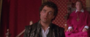 Movie still from “Dangerous Beauty” (1998), directed by Marshall Herskovitz – A person wearing a leather jacket; Close Up shot, High angle