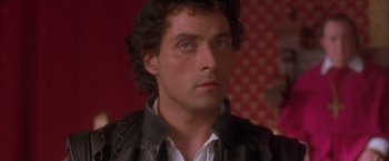 Movie still from “Dangerous Beauty” (1998), directed by Marshall Herskovitz – A person wearing a leather jacket; Close Up shot, High angle