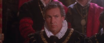 Movie still from “Dangerous Beauty” (1998), directed by Marshall Herskovitz – A person wearing a suit; Close Up shot, High angle