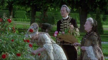 Movie still from “Dangerous Liaisons” (1988), directed by Stephen Frears – A man and a woman dressed in period clothing; Medium shot, Over the shoulder angle