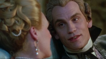 Movie still from “Dangerous Liaisons” (1988), directed by Stephen Frears – A man and a woman looking at each other in front of a mirror; Close Up shot, Over the shoulder angle