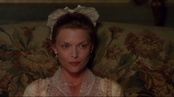 Movie still from “Dangerous Liaisons” (1988), directed by Stephen Frears – A person sitting on a chair; Close Up shot, High angle