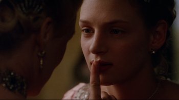 Movie still from “Dangerous Liaisons” (1988), directed by Stephen Frears – A woman with her finger on her lips; Close Up shot, Over the shoulder angle