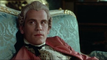 Movie still from “Dangerous Liaisons” (1988), directed by Stephen Frears – A person sitting on a chair; Close Up shot, Over the shoulder angle
