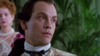 Movie still from “Dangerous Liaisons” (1988), directed by Stephen Frears – A man wearing a suit and tie; Close Up shot, Low angle