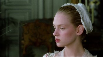 Movie still from “Dangerous Liaisons” (1988), directed by Stephen Frears – A young woman in a white dress looking to the side; Close Up shot, Over the shoulder angle
