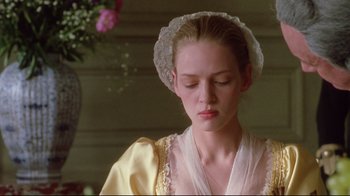 Movie still from “Dangerous Liaisons” (1988), directed by Stephen Frears – A young woman in a yellow dress and a white hat; Close Up shot, Low angle