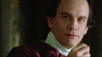 Movie still from “Dangerous Liaisons” (1988), directed by Stephen Frears – A person wearing a neck brace; Close Up shot, Over the shoulder angle