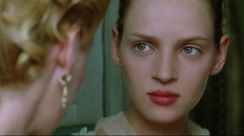 Movie still from “Dangerous Liaisons” (1988), directed by Stephen Frears – A woman looking into a mirror while wearing earrings; Close Up shot, Over the shoulder angle