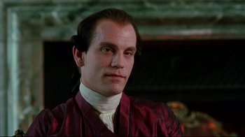 Movie still from “Dangerous Liaisons” (1988), directed by Stephen Frears – A person wearing a suit and tie; Close Up shot, Low angle