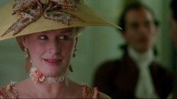 Movie still from “Dangerous Liaisons” (1988), directed by Stephen Frears – A person wearing a hat; Close Up shot, Over the shoulder angle