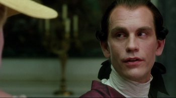 Movie still from “Dangerous Liaisons” (1988), directed by Stephen Frears – A person wearing a costume; Close Up shot, Over the shoulder angle