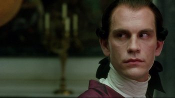 Movie still from “Dangerous Liaisons” (1988), directed by Stephen Frears – A person wearing a costume; Close Up shot, Over the shoulder angle